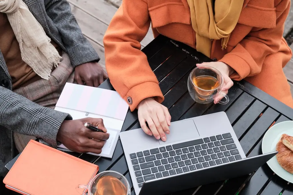 A person typing effective prompts into the ChatGPT interface on a laptop to conduct keyword research with three simple steps