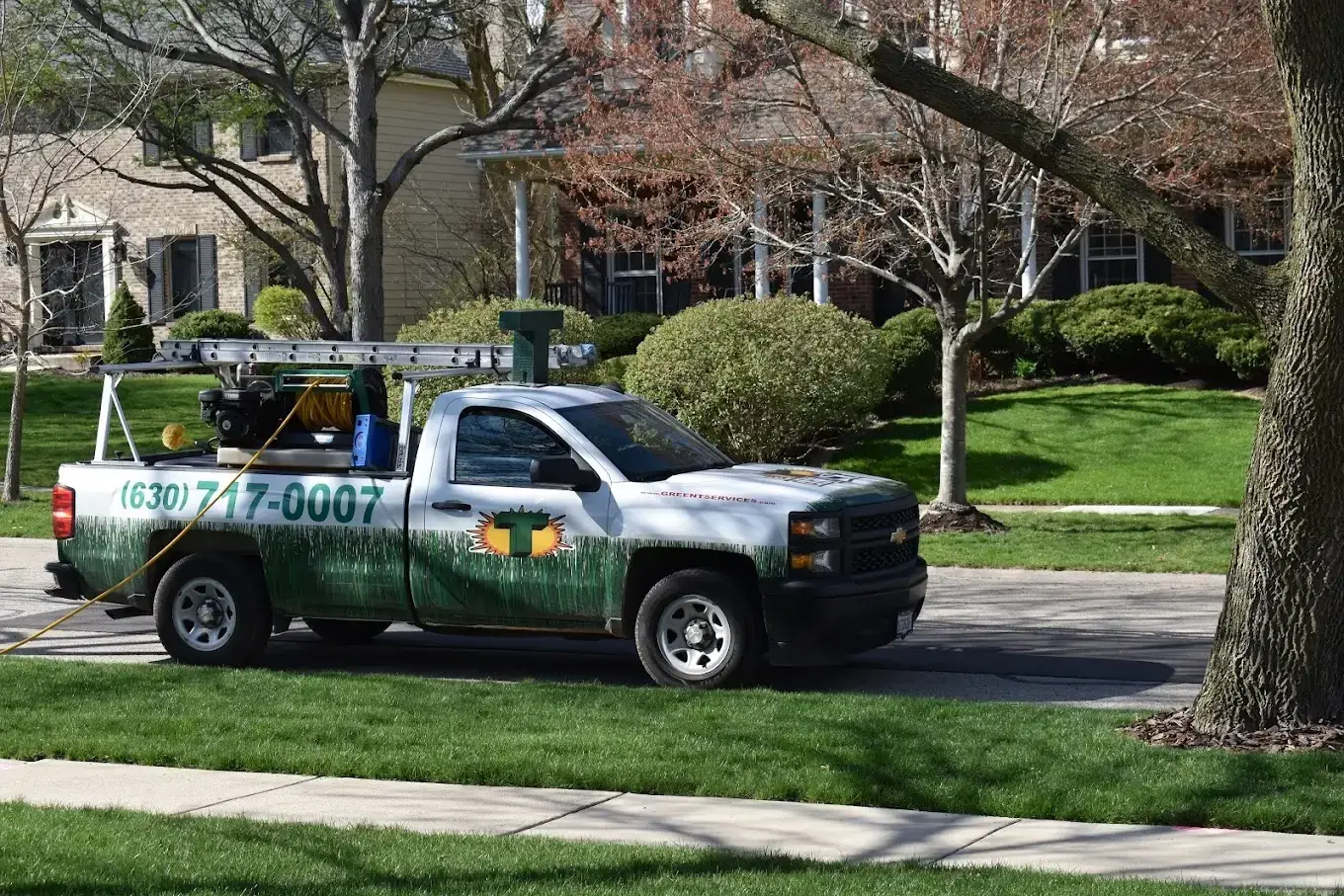 service truck of a home improvement business parked in a suburban area, ideal for home services marketing.